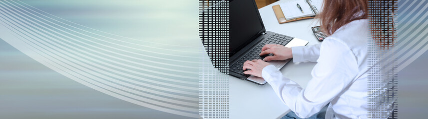 Businesswoman typing on a laptop; panoramic banner