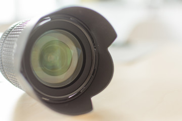 Modern digital camera lense closeup. Black camera lense. Copy space for design.