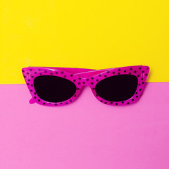 Stylish bright sunglasses. Minimal flat lay art