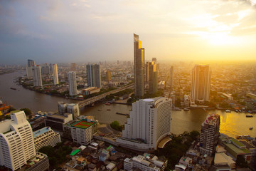 Cityscape in Bangkok Thailand and river with sunset