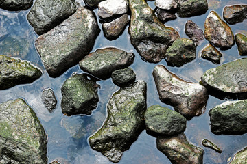 A rocky cove with calm waves