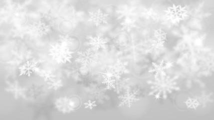 Christmas blurred background of complex defocused big and small falling snowflakes in white and gray colors with bokeh effect