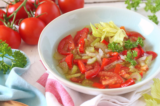 Summer vitamin detox soup with celery, red bell pepper and tomatoes