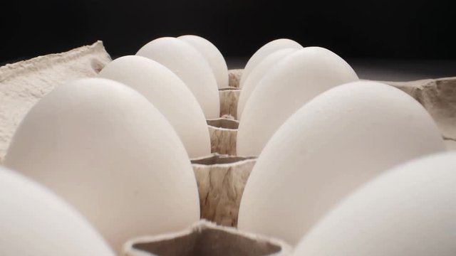 Raw fresh egg in pack on whitetable, slide shoot
