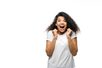 happy curly african american girl celebrating isolated on white