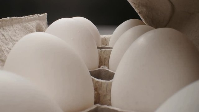 Raw fresh egg in pack on whitetable, slide shoot