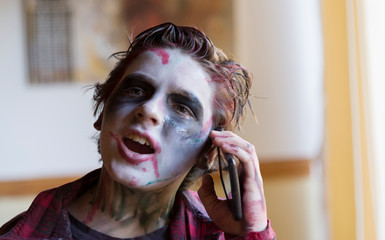 Modern zombie talking on cellphone