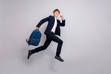 Full length body size view photo nice pupil hold hand bag backpack rucksack want courses secondary school private excited positive white shirt black blazers pants trousers isolated grey background