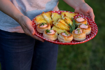picnic snacks in the hands of a woman