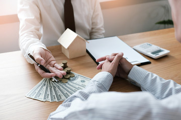 Business people signing contract making a deal with real estate agent Concept for consultant and home insurance concept.