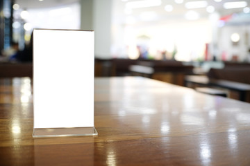 Menu frame space for text marketing promotion standing on wood table in Bar restaurant cafeใ