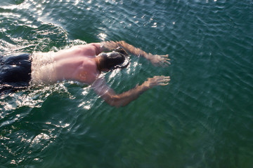 Male young swimmer underwater - sea, swimming lessons, diving