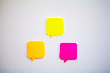 Colorful stickers on white wall. Empty Space for text