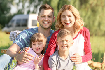 Fototapeta premium Happy family on summer picnic in park
