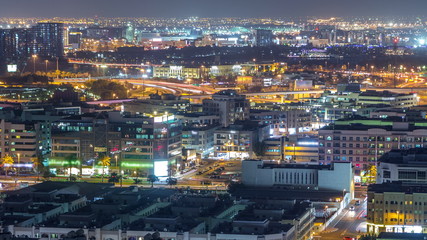 Aerial view of neighbourhood Deira with typical buildings night timelapse, Dubai, United Arab Emirates