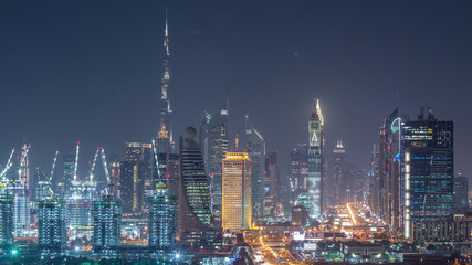 Dubai skyline with beautiful city center lights and Sheikh Zayed road traffic night timelapse, Dubai, United Arab Emirates
