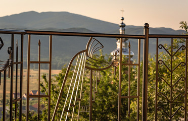 Forged fence with monks