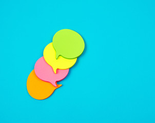 stack of multicolored empty paper stickers in the form of clouds