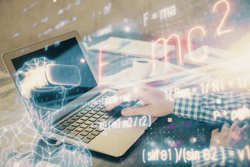 Science formula hologram with man working on computer on background. Education concept. Double...