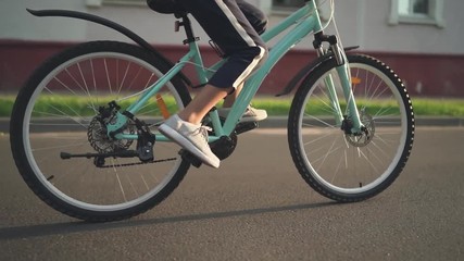 Child Girl Riding Bike at Sunset. 60 fps Footage