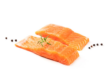 Two slices of salmon with black peppercorns and rosemary on a white background with a place for text