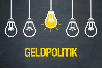 Geldpolitik / Tafel mit Glühbirnen