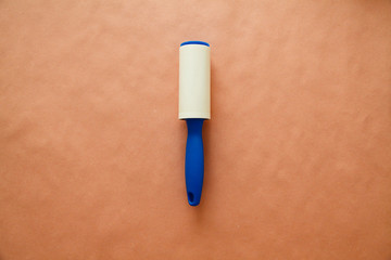 Cloths Roller cleaner Isolated on pink background. Cleaning concept. Dry-cleaner concept. Pet Hair Remover on the pink background. Sticky Silicone Dust Wiper. 