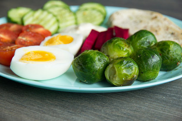 Chicken fillet, Brussels sprouts, eggs, tomatoes, cucumbers, white sauce