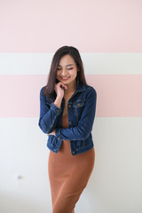 Asian girl, shot body length, is wearing summer outfit with a cute emotion