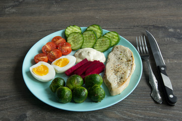 Chicken fillet, Brussels sprouts, eggs, tomatoes, cucumbers, white sauce