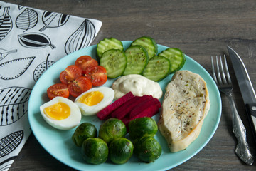 Chicken fillet, Brussels sprouts, eggs, tomatoes, cucumbers, white sauce