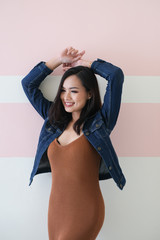 Asian girl, shot body length, is wearing summer outfit with a cute emotion