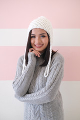 Asian girl, shot body length, is wearing a winter outfit with a cute emotion