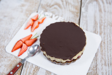 chocolate cake with strawberries and nuts