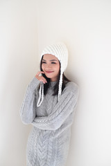 Asian girl, shot body length, is wearing a winter outfit with a cute emotion