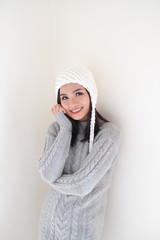 Asian girl, shot body length, is wearing a winter outfit with a cute emotion