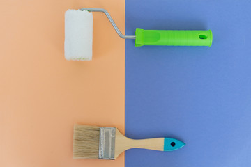 Painting brush and roller on colorful background. Preparation for repair