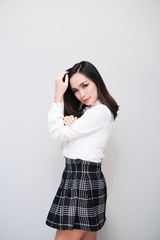 Asian girl with nice outfit, short skirt and long sleeve shirt