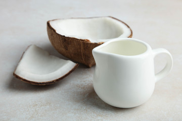 coconut and coconut milk in milk jug