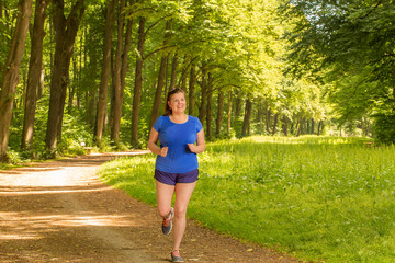 Woman runs in the park in her training session