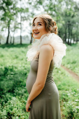 Fototapeta premium Young happy pregnant woman relaxing and enjoying life in nature.