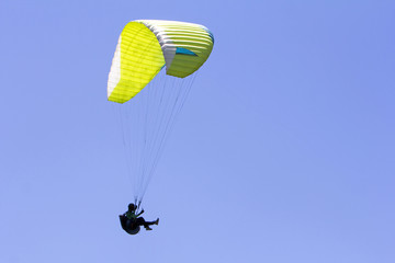 Paragliding in the blue sky as background extreme sport
