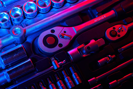 A set of wrench and adapters with the bits in the suitcase