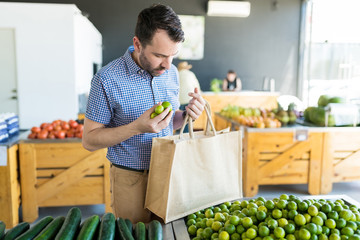 Shopper With Lemons And Shopping Bag At Store