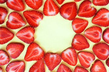 Strawberry slice red background texture. Top view with place for your text. Concept of summer eco food