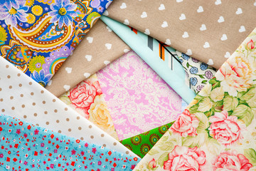 Obraz premium Colorful cotton fabric as background. Textured background from cotton fabric. Textiles for bed linen and clothing. Natural fashionable fabric for sewing.