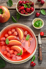 Delicious fruit soup with fresh apples and cherries