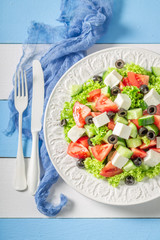 Tasty Greek salad with tomatoes, lettuce and feta cheese