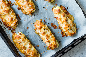 Baked Zucchini Courgettes Stuffed with Cheese and Dill.
