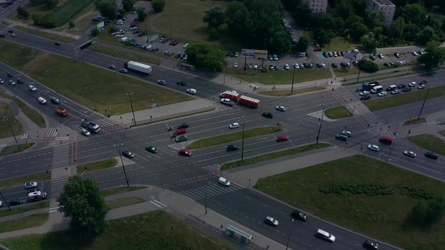 Aerial view. Drone flying right above incredible highway junction intersection with multiple road levels and flyovers.  City Warsaw / Poland. Shot on Drone 4K.
